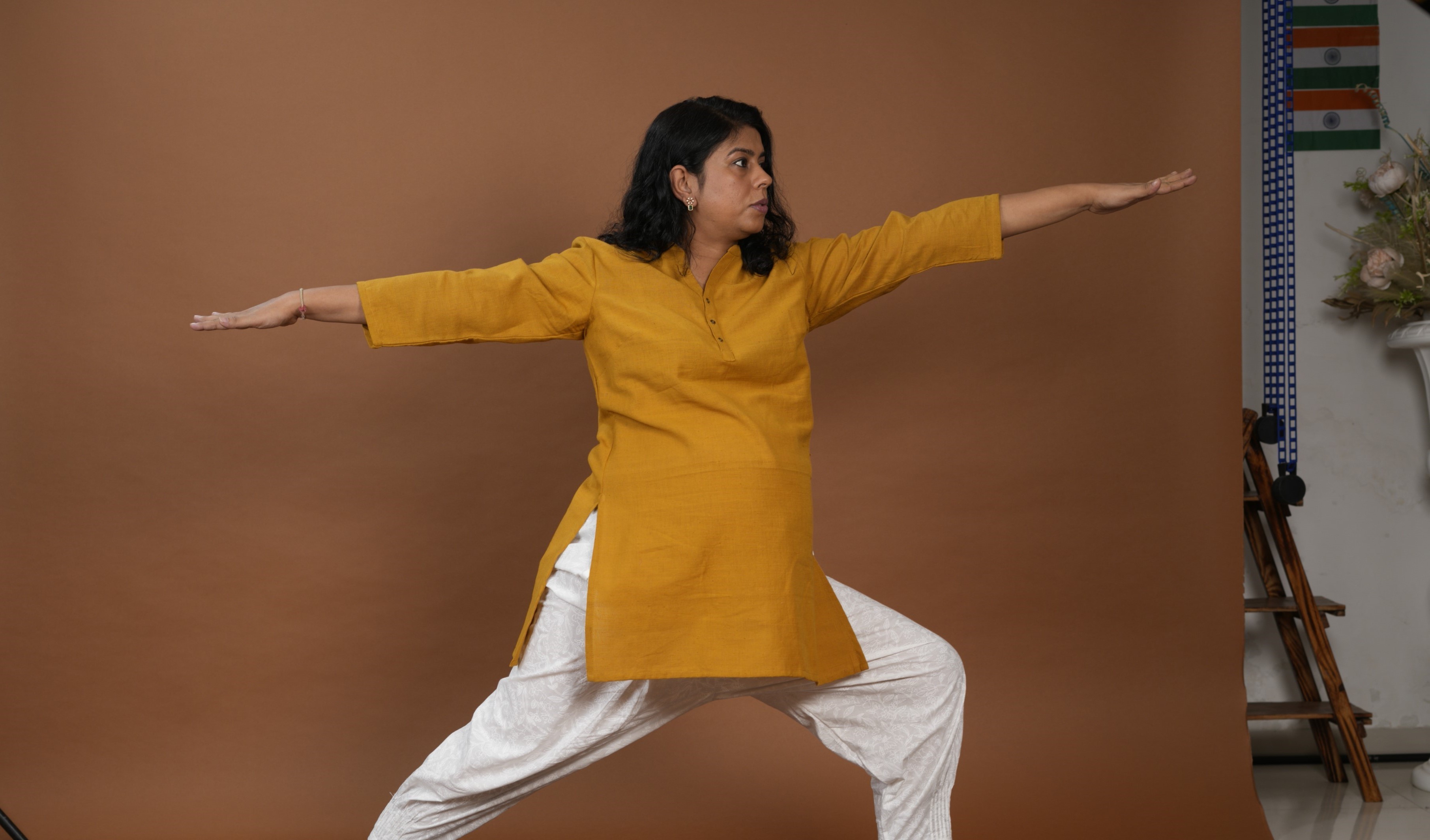 Pregnant woman practicing Warrior II